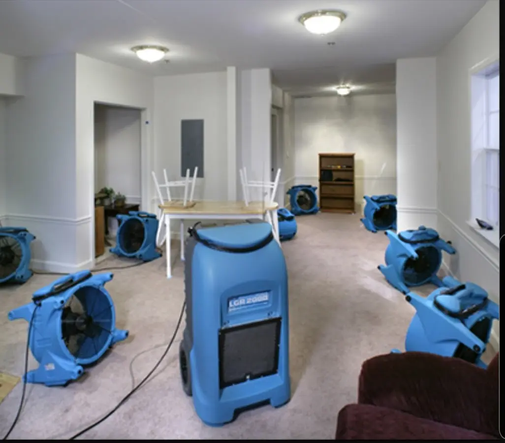 Air movers and dehumidifier setup for Water Damage Restoration in Groton